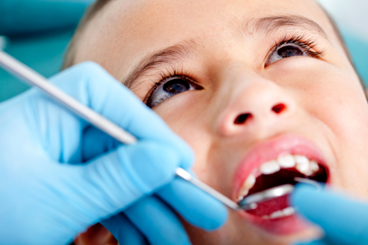 Brown Eyed Child At Dentist