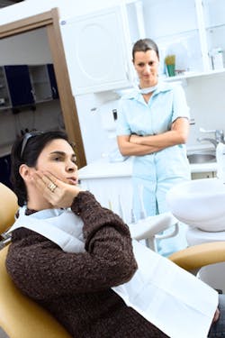 Dental Pro With Patient In Pain Dental Pro With Patient In Pain