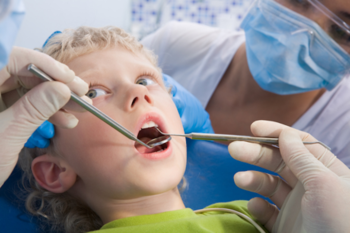 Kid At Dentist