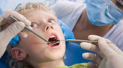 Kid At Dentist