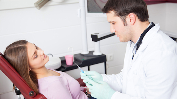 Young Dentist With Pt