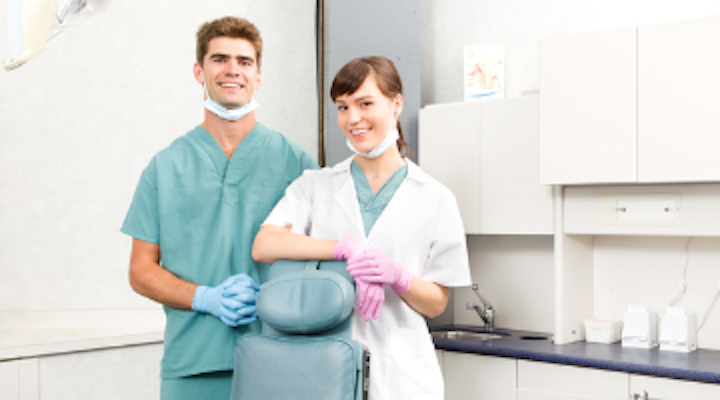 Dentist Assistant Uniform  - Cheerful Young Female Dentist Treats The Patient, She Stands And.