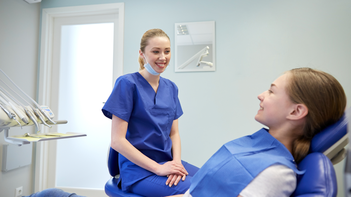 Dentist With Patient