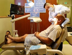 Dental chairs equipped with televisions can help distract patients. Dental chairs equipped with televisions can help distract patients.