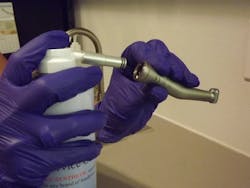 A handpiece is sprayed with oil.