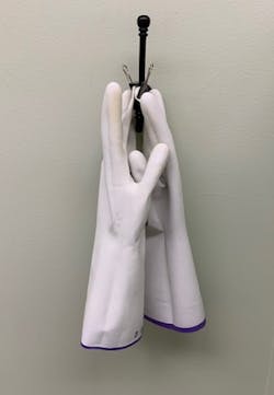 Figure 2: Gloves were turned inside out, washed with antimicrobial soap, and hung overnight by clipping the fingertips with a binder clip to air dry. Figure 2: Gloves were turned inside out, washed with antimicrobial soap, and hung overnight by clipping the fingertips with a binder clip to air dry.