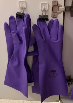 Figure 3: Gloves stored by clipping by the fingertips and hanging in designated storage area