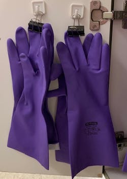 Figure 3: Gloves stored by clipping by the fingertips and hanging in designated storage area Figure 3: Gloves stored by clipping by the fingertips and hanging in designated storage area
