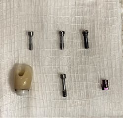 Figure 7: Comparison of different screws on hand in an attempt to match the existing screw Figure 7: Comparison of different screws on hand in an attempt to match the existing screw