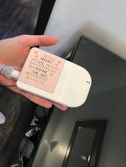 Figure 1: The Easy Flow device has a clip on the back side of it. I wear it on the back of my scrub top. Figure 1: The Easy Flow device has a clip on the back side of it. I wear it on the back of my scrub top.