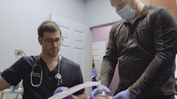 Dr. Spencer Wade working in the clinical setting Dr. Spencer Wade working in the clinical setting