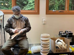 Dr. Yamaoka sands safety helmets for his first face shield design in his garage in March 2020. Dr. Yamaoka sands safety helmets for his first face shield design in his garage in March 2020.