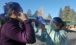 Figure 4: Jingjing Qian, RDH-EA, met Carolina Lopez, CNA, in the parking lot to teach her oral photography and dental terminology. Figure 4: Jingjing Qian, RDH-EA, met Carolina Lopez, CNA, in the parking lot to teach her oral photography and dental terminology.