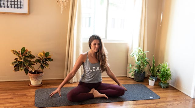 Caitlin Parsons demonstrates sa yoga technique.