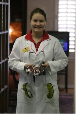 The author&apos;s assistant, Courtney, with several pairs of laser safety glasses