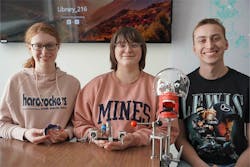 Biomedical engineering majors on the Carpenter Robotic Dental Team&mdash;Kara Huse, Jillian Linder, and Logan Jundt&mdash;pose in the spring of 2023 with a prosthetic model they named &ldquo;Chip.&rdquo; This model is used in the design of a prototype robot to enable a dentist to fill cavities remotely.