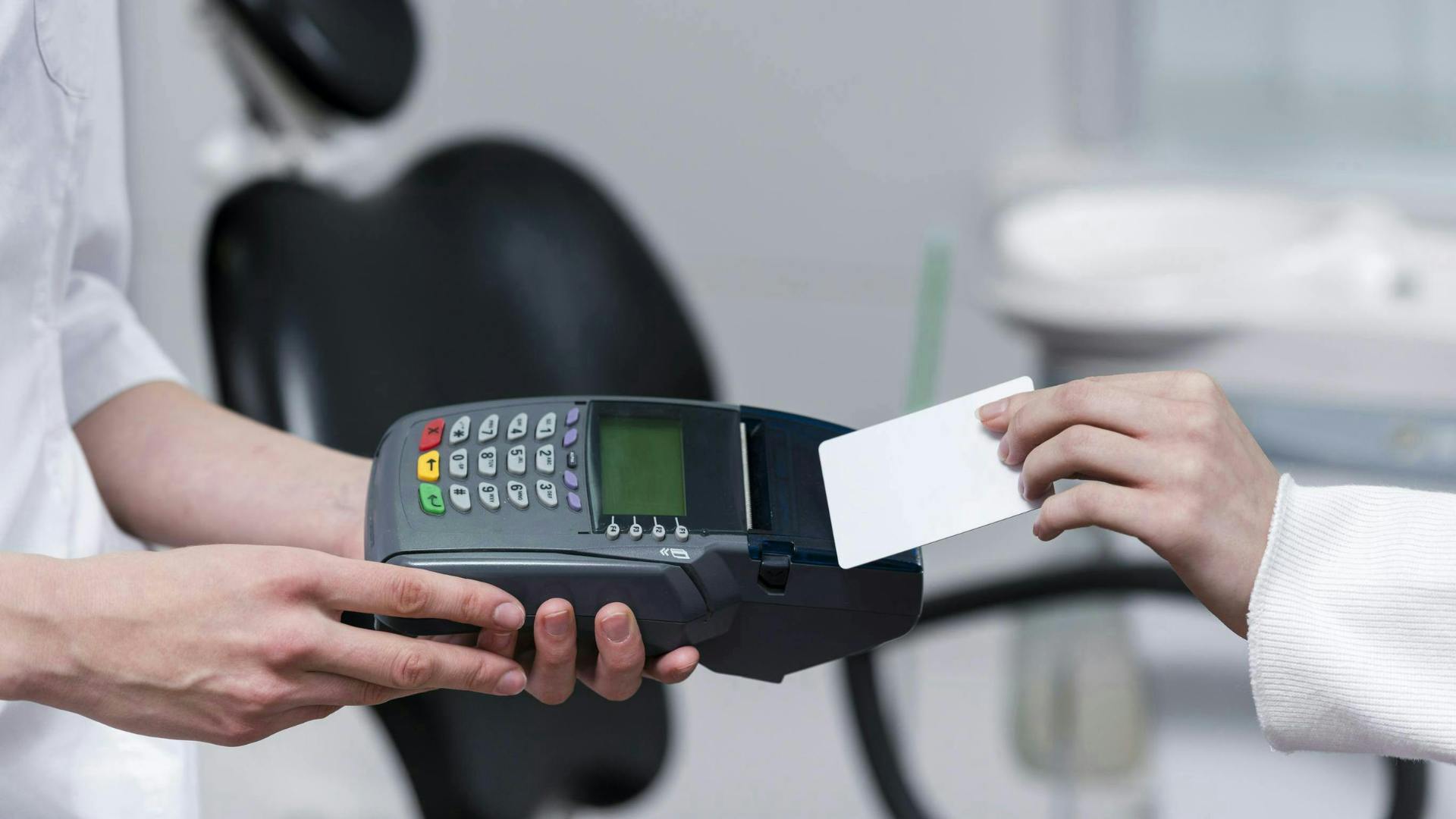 Dental patient paying fee