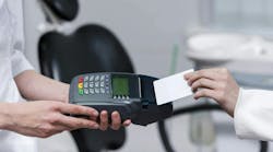 Dental patient paying fee Dental patient paying fee