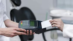 Dental patient paying fee Dental patient paying fee