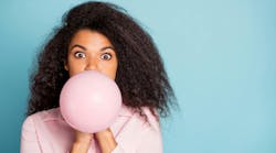 woman blowing balloon woman blowing balloon