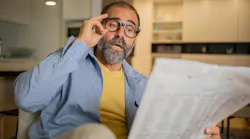 person reading newspaper