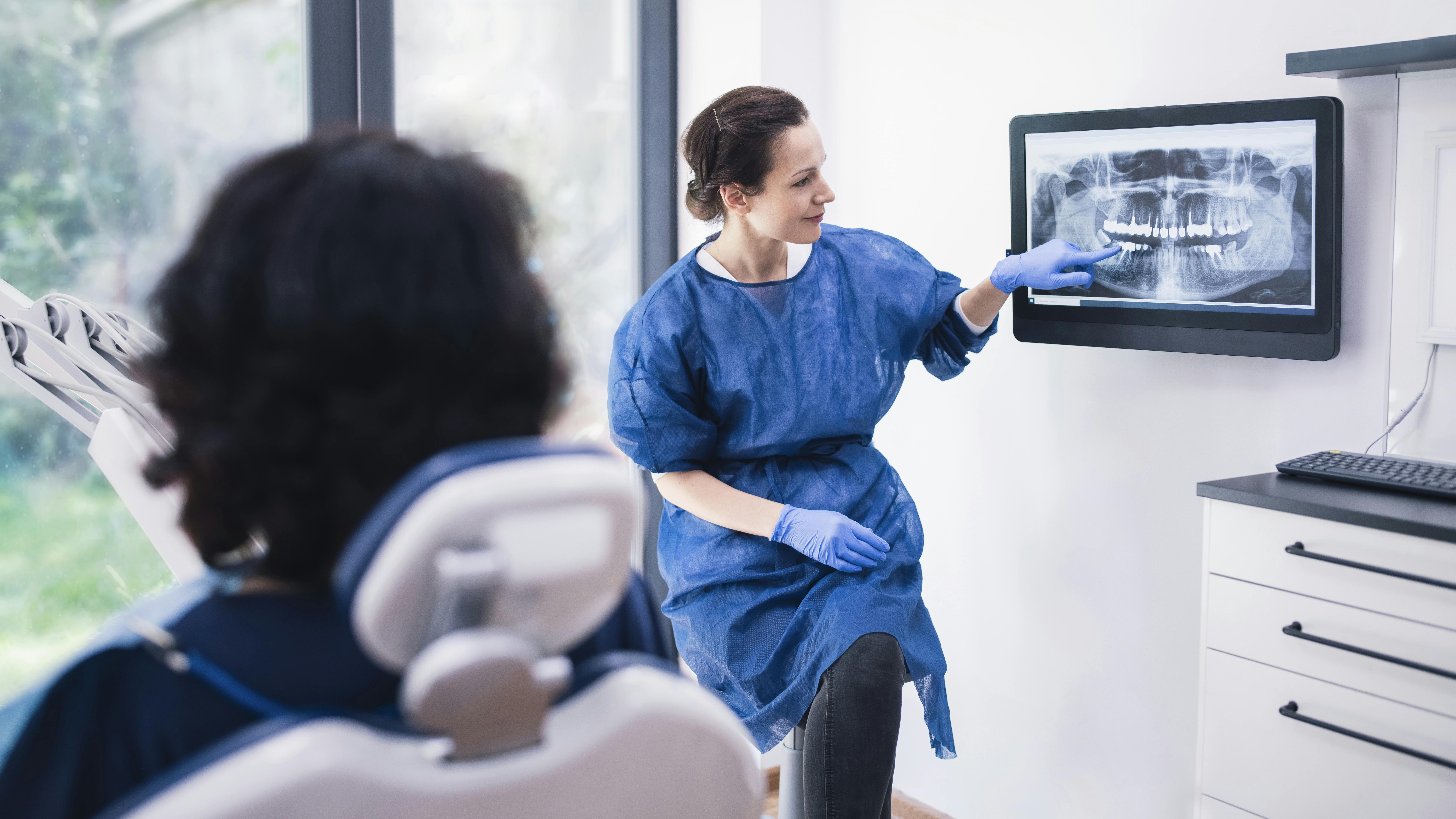 dentist discussing x-rays with a patient