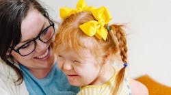 mom holding a little girl mom holding a little girl