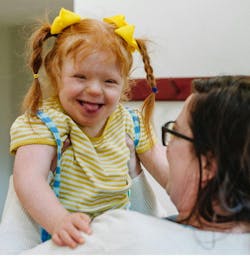 mom holding her daughter mom holding her daughter