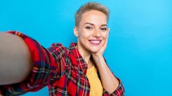 Woman with veneers posing for a selfie Woman with veneers posing for a selfie