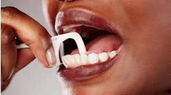 Woman using dental pick floss Woman using dental pick floss