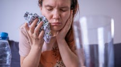 Young woman recovering from tooth extraction Young woman recovering from tooth extraction