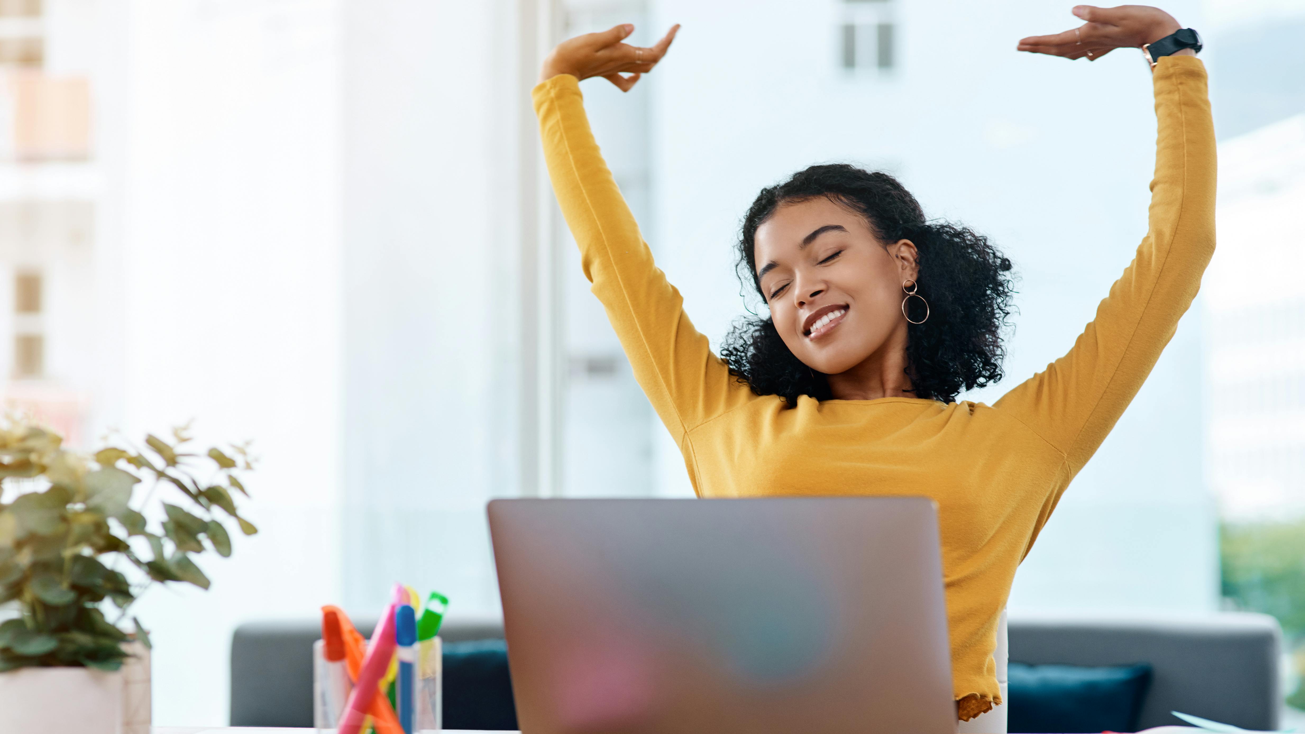 lady stretching at her computer