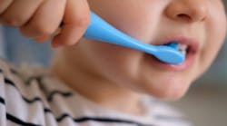 Young child brushing their teeth Young child brushing their teeth