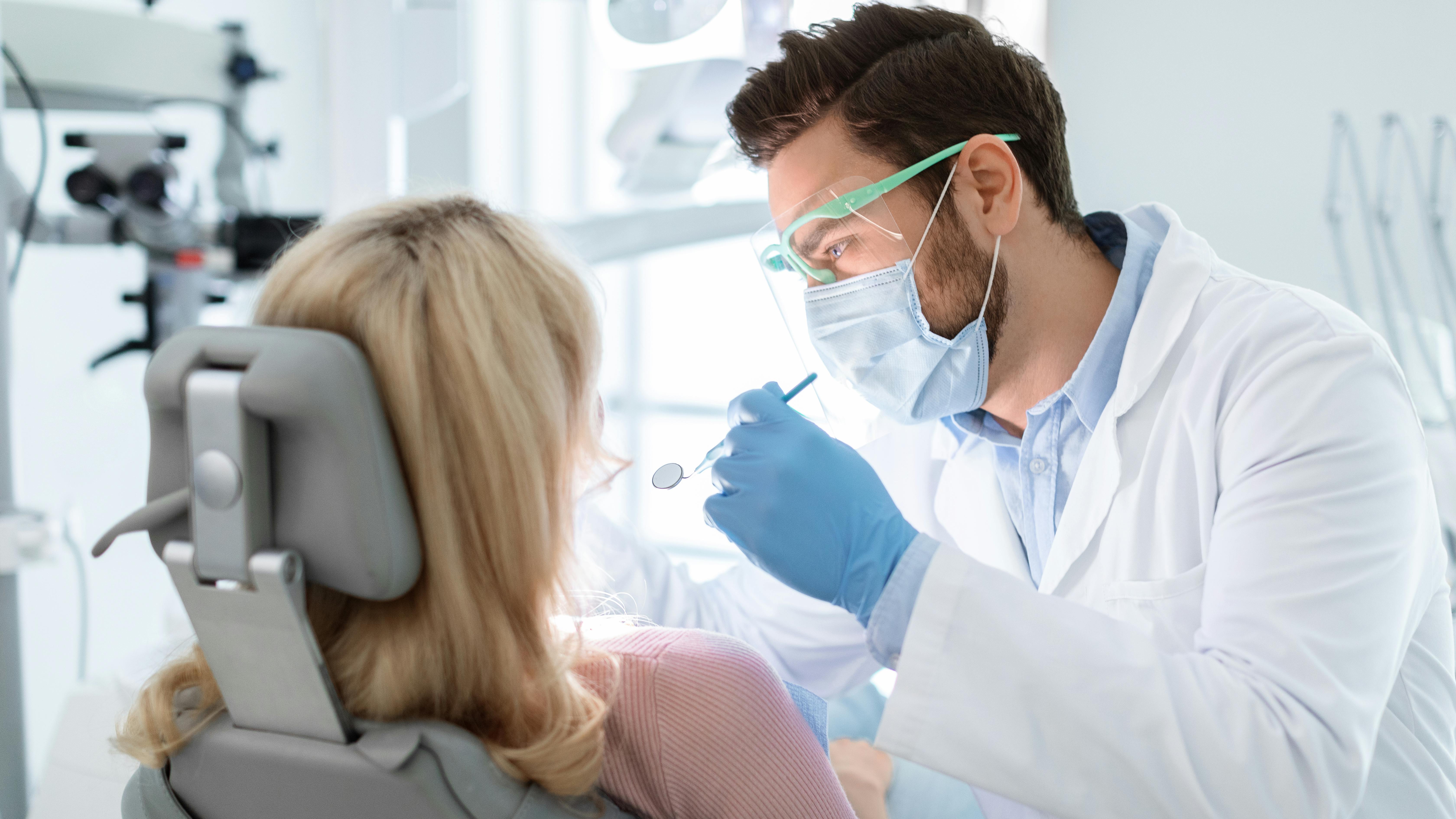 a dentist treating a patient