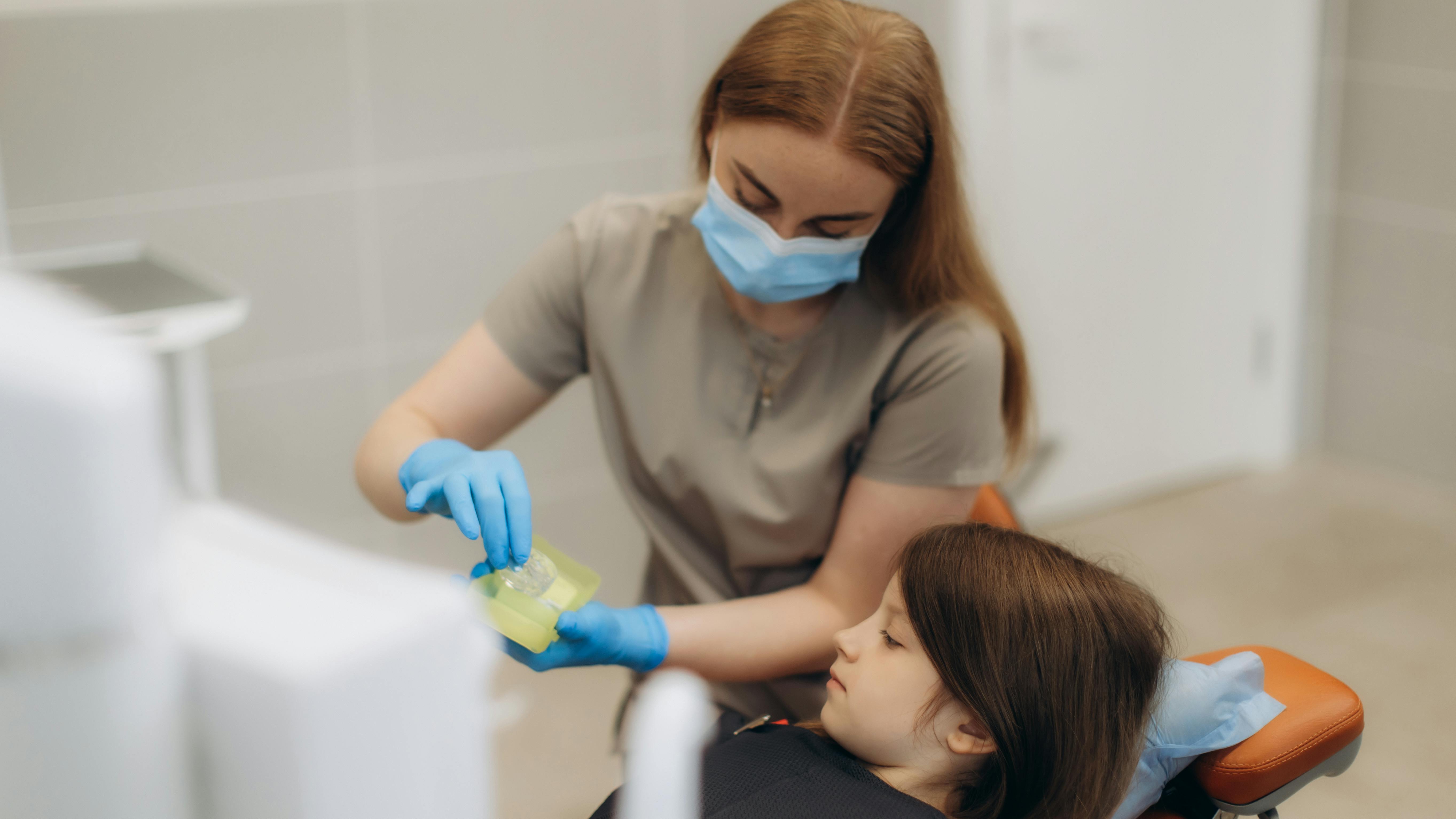 hygienist treating patient