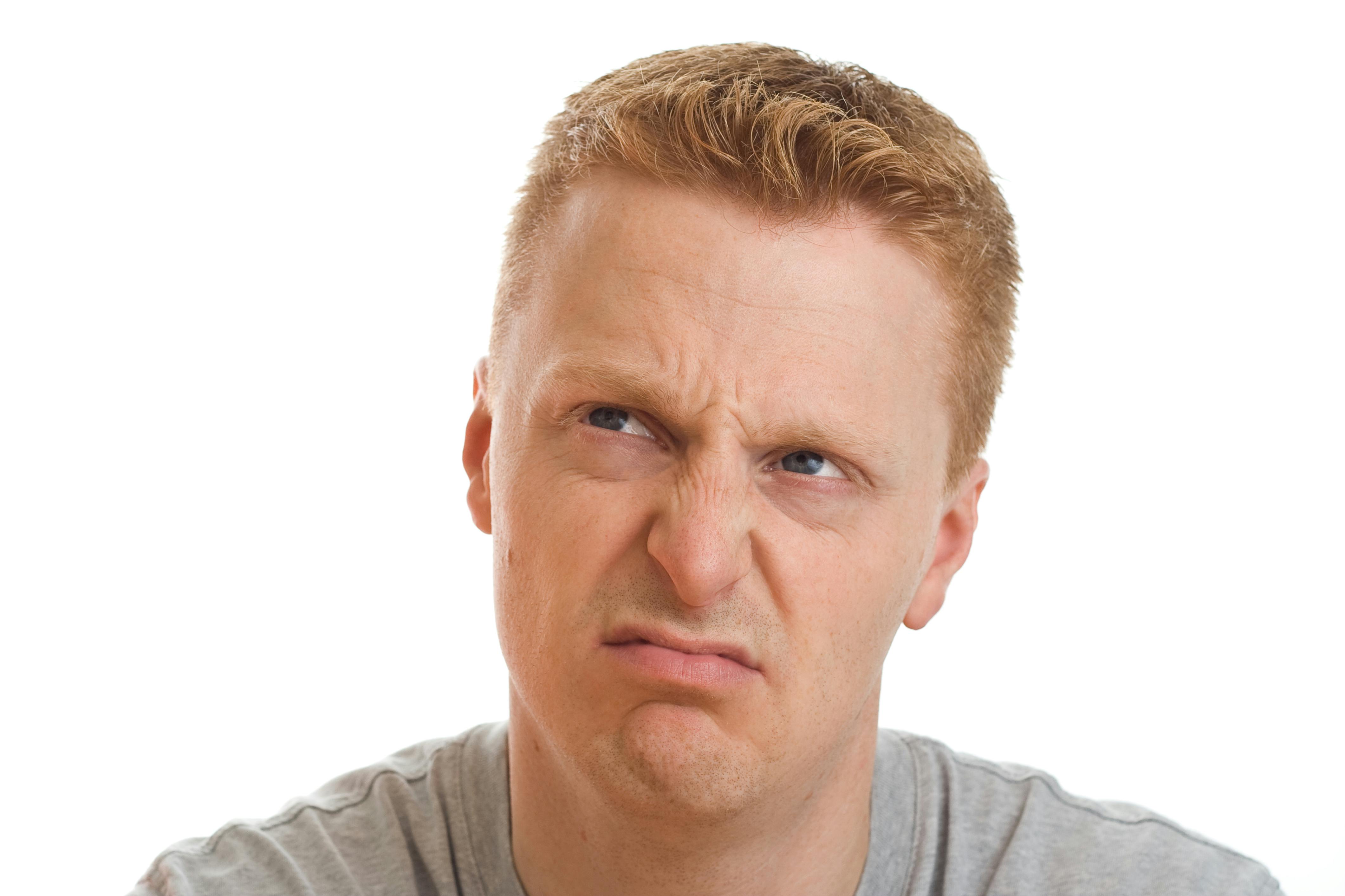 a man with a scowl on his face