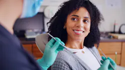 Patient smiling at dental prof