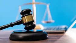gavel with the scales of justice in the background