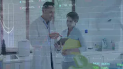a dentist talking to an assistant about a patient's chart