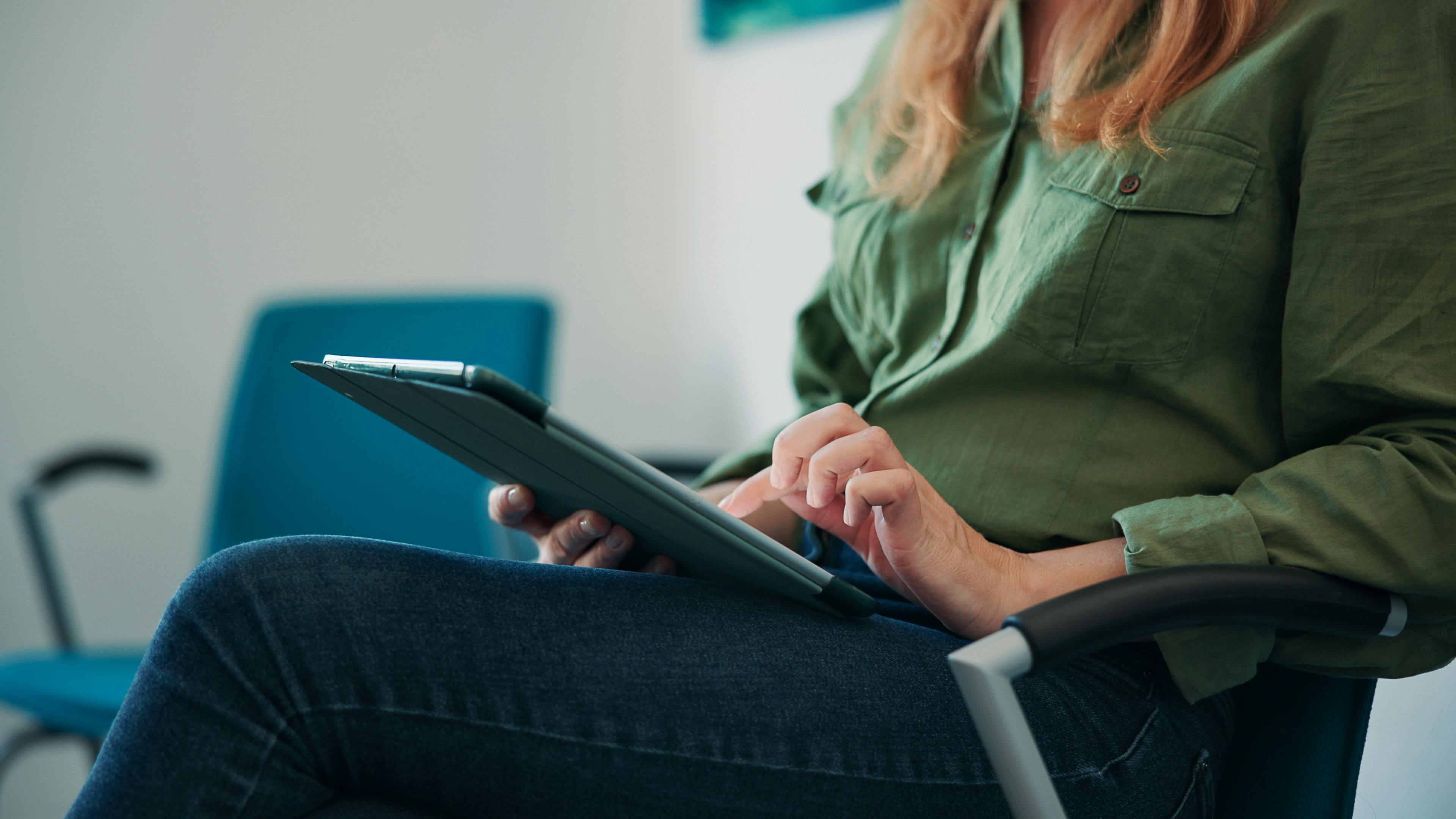 a woman using a computer tablet