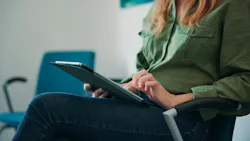 a woman using a computer tablet