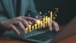 hands typing on a laptop computer with bars and percentage signs glowing