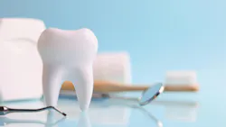 a tooth, dental floss, toothbrush, mirror, and a dental instrument