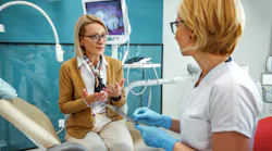 dental patient speaking with a dental professional